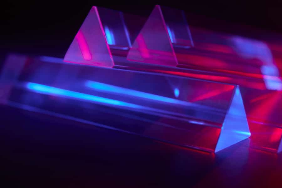 Multiple exposure crystal triangular prism optical glass with red and blue light spectrum abstract background